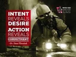 Two firefighters putting water on a fire with quote &quot;We are what we repeatedly do; excellence, then, is not an act but a habit&quot;